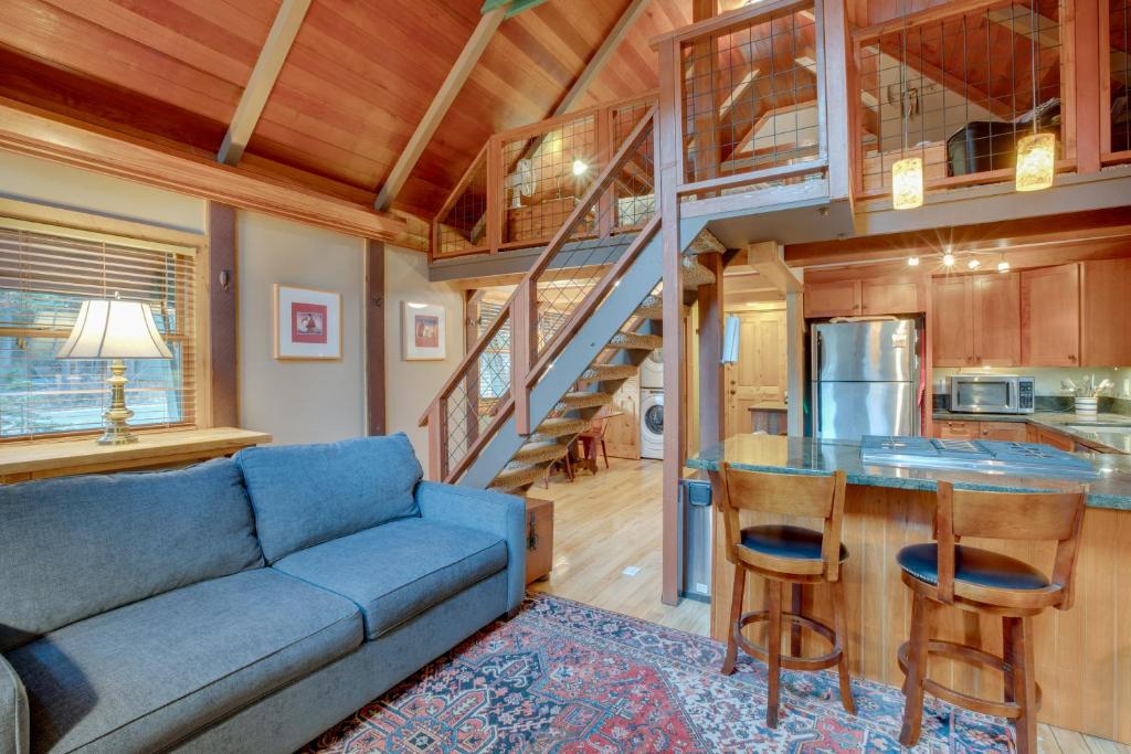 a living room with a couch and a kitchen with a staircase at Tahoma Retreat about 2 Mi to Homewood Mountain Resort in Tahoma