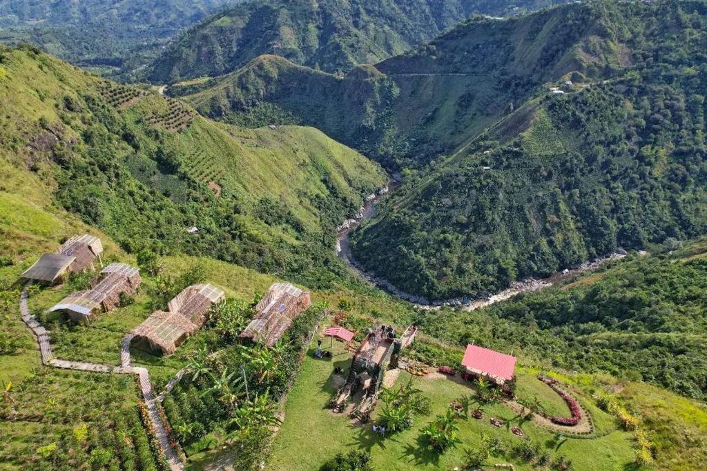 an aerial view of a village on a mountain at MAYU in San Agustín
