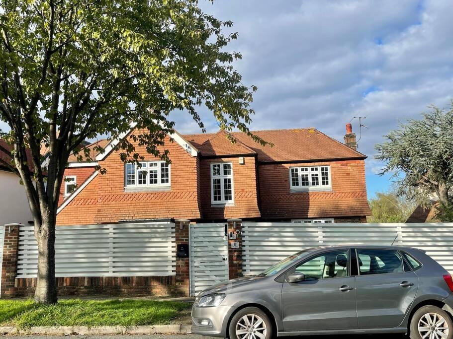 a silver car parked in front of a house at Lavender Oaks Detached Country House in Purley