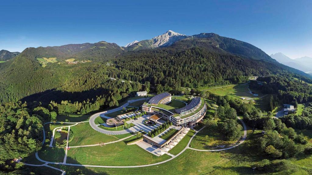 an aerial view of a building in the middle of a mountain at Kempinski Hotel Berchtesgaden in Berchtesgaden