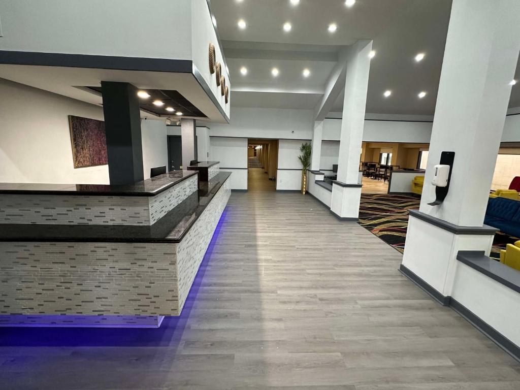 a lobby of a hotel with a reception desk at SureStay Plus by Best Western Mobile I-65 in Mobile