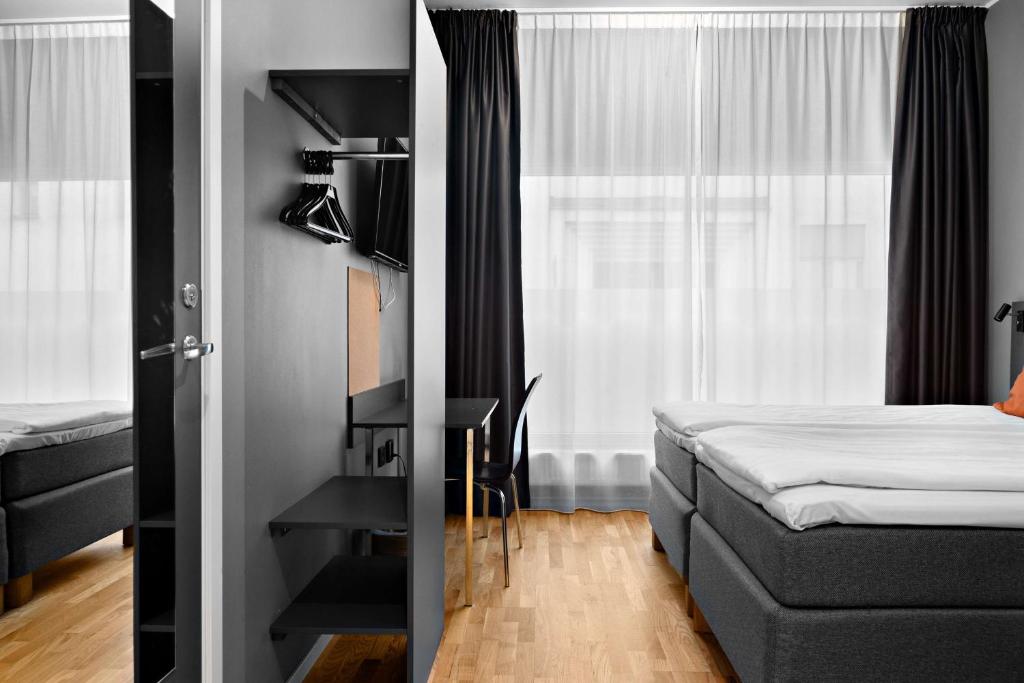 Postel nebo postele na pokoji v ubytování Aiden by Best Western Stockholm City