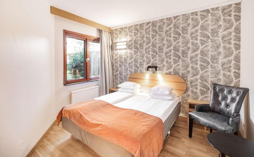 Postel nebo postele na pokoji v ubytování Hotell Heden - BW Signature Collection