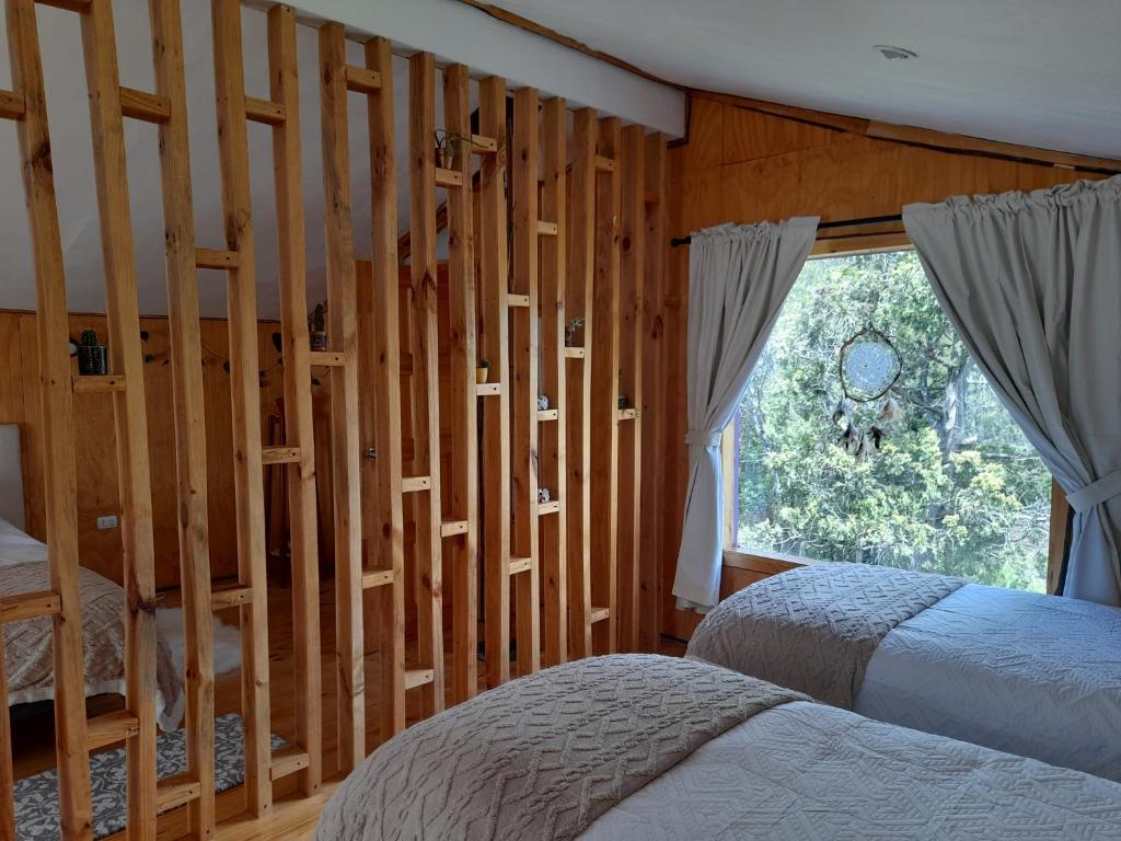 Postel nebo postele na pokoji v ubytování Cabaña Casa Morada