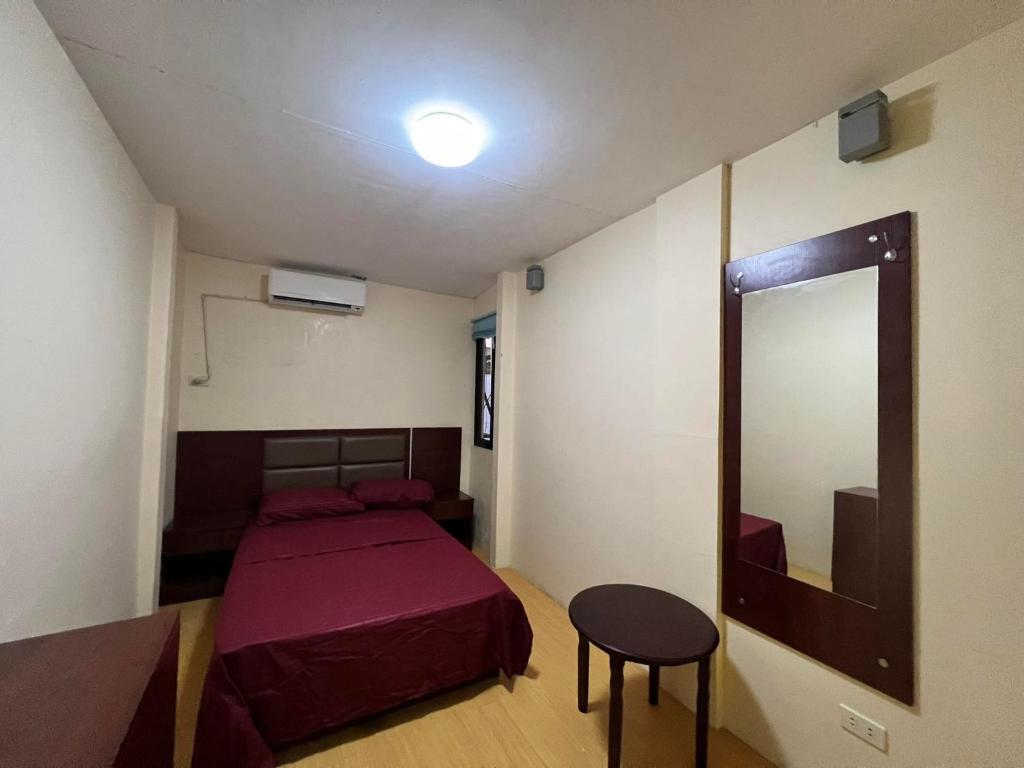 Postel nebo postele na pokoji v ubytování APARTELLE BORACAY