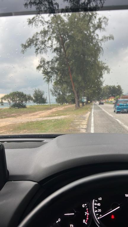 a view of the dashboard of a car driving down a road at AF HOMESTAY in Dungun