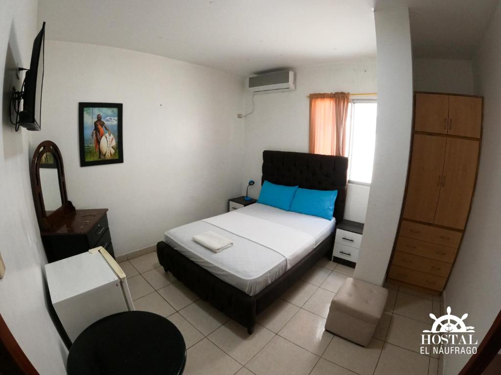 Postel nebo postele na pokoji v ubytování Hostal El Naufrago 1