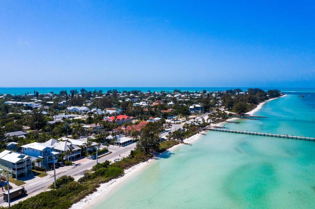 an aerial view of the beach and the ocean at Barefoot by the Bay at Bayside Bungalow in Anna Maria