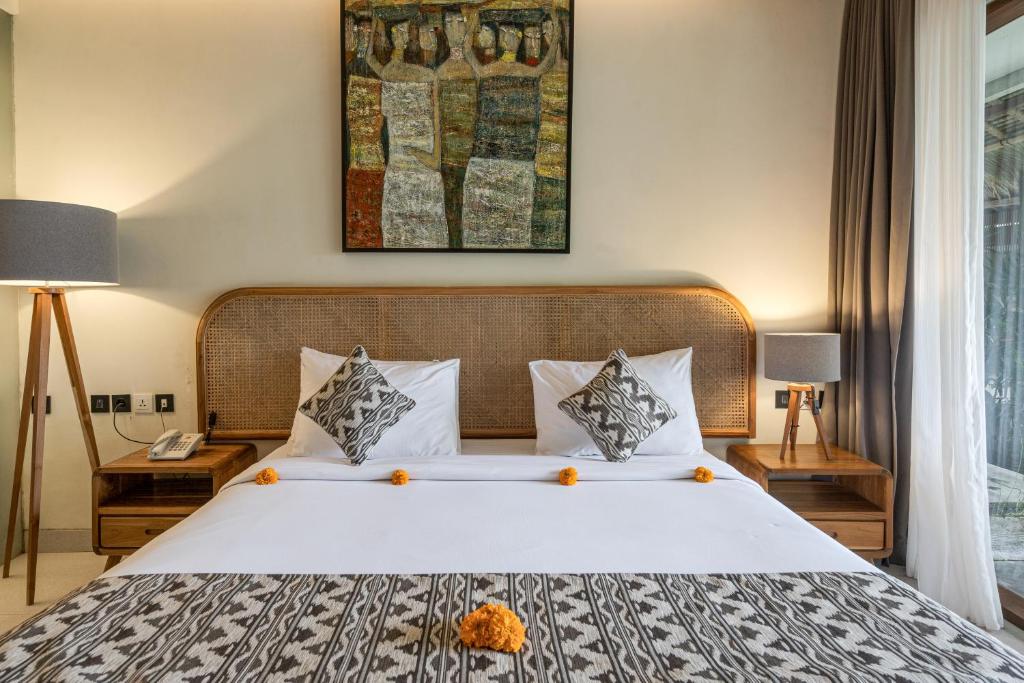 Postel nebo postele na pokoji v ubytování Kandarpa Ubud CHSE Certified