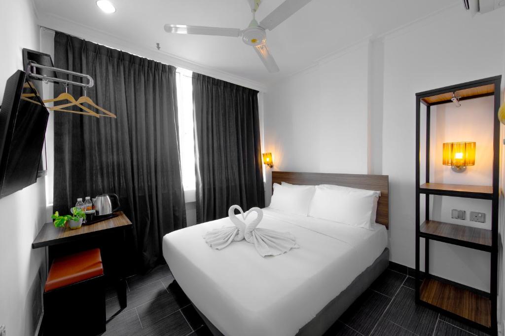 Postel nebo postele na pokoji v ubytování Tune Hotel - Waterfront Kuching