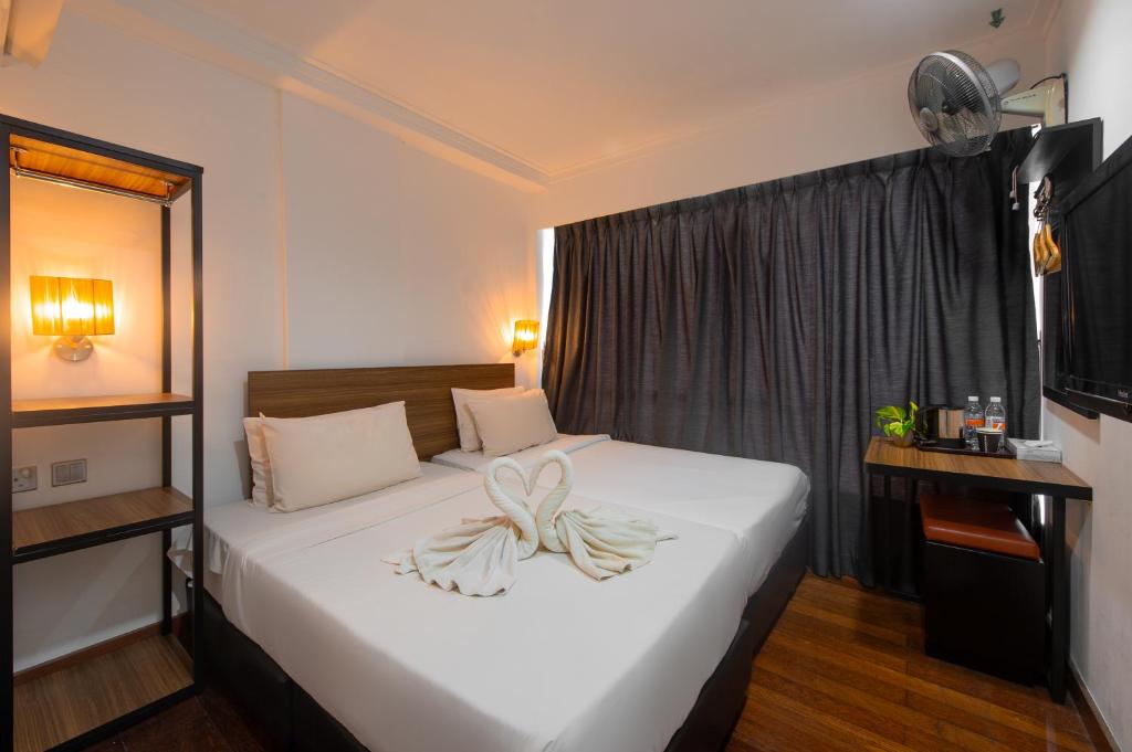 Postel nebo postele na pokoji v ubytování Tune Hotel - Waterfront Kuching
