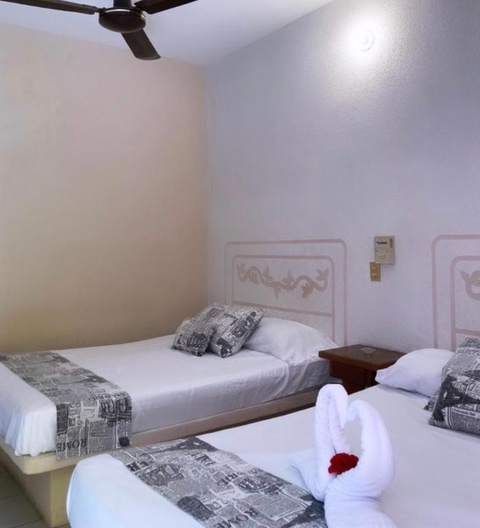 Postel nebo postele na pokoji v ubytování Hotel El almirante