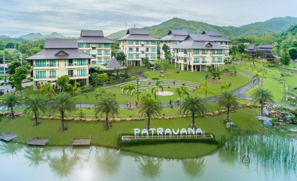 an aerial view of a resort with palm trees and buildings at Patravana Resort in Phayayen