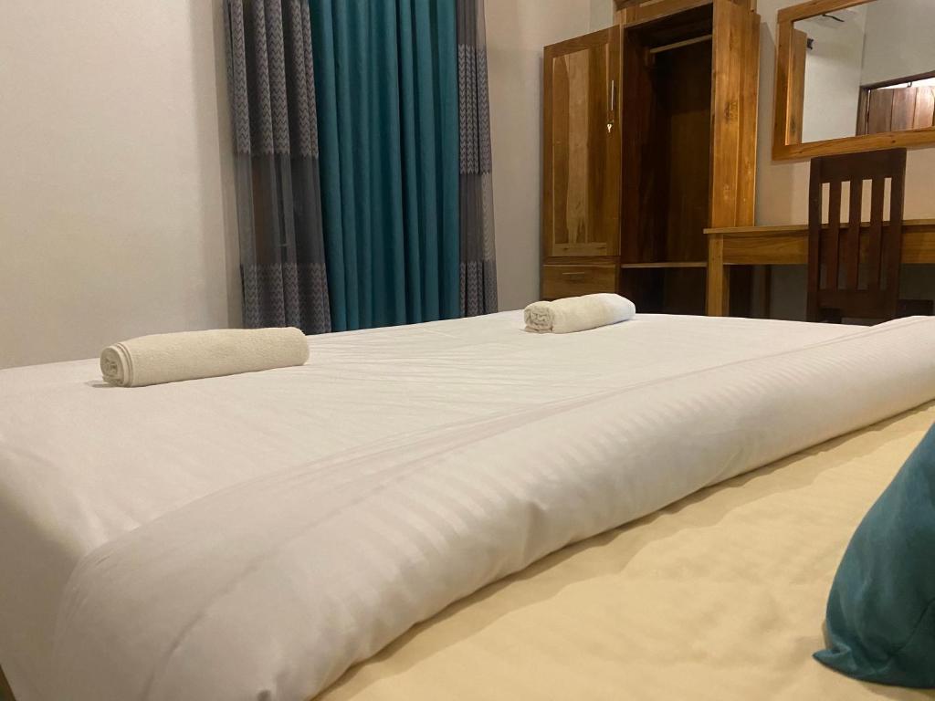 Postel nebo postele na pokoji v ubytování Beach Escape