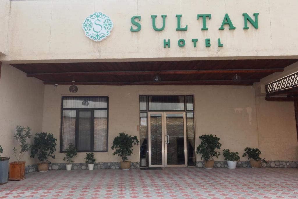 a hotel with a sign that reads sunan hotel at Sultan Kyzyl-Kia 