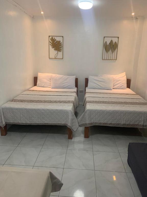 Postel nebo postele na pokoji v ubytování Nolina's Transient Rooms - Alaminos, Pangasinan