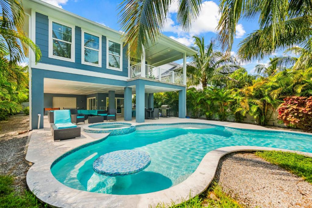 an exterior view of a house with a swimming pool at Endless Summer in Anna Maria