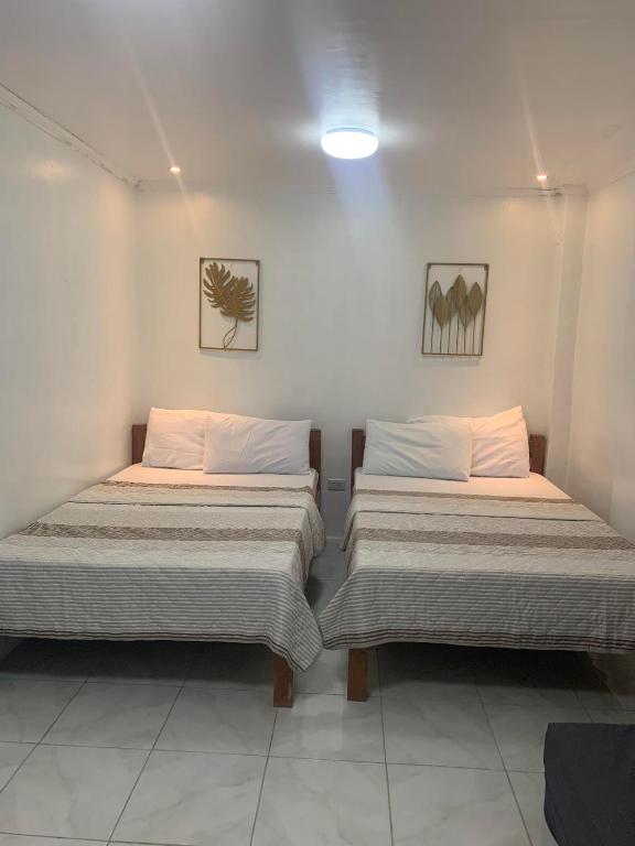 Postel nebo postele na pokoji v ubytování Nolina's Transient Rooms - Alaminos, Pangasinan