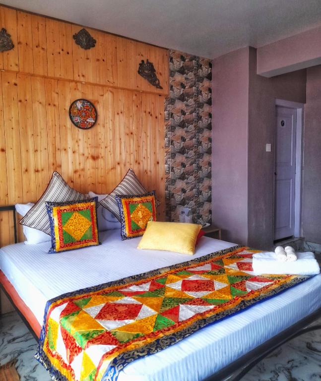 Postel nebo postele na pokoji v ubytování Mysa Homestays