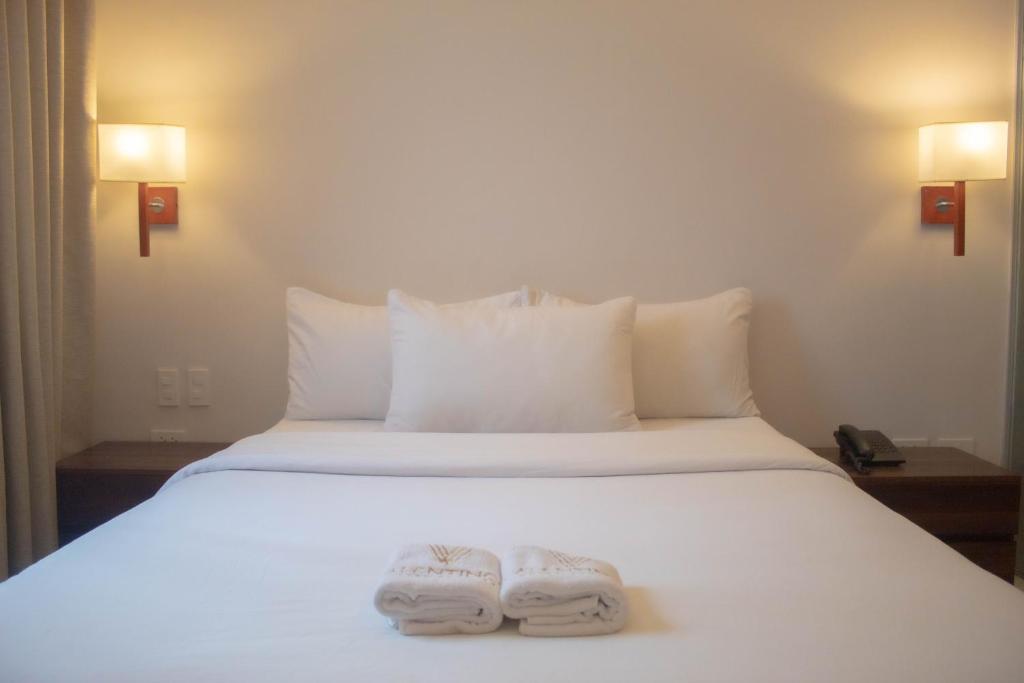 Postel nebo postele na pokoji v ubytování Valentino's Hotel