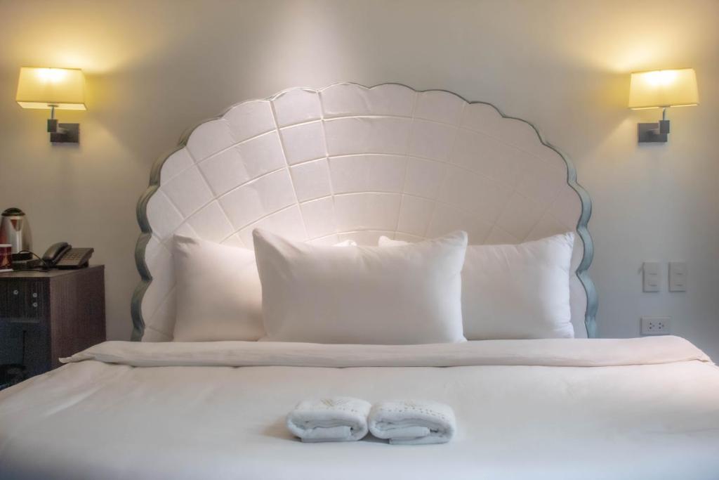 Postel nebo postele na pokoji v ubytování Valentino's Hotel
