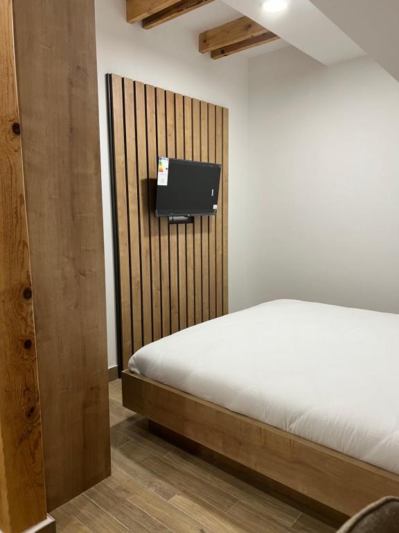 Postel nebo postele na pokoji v ubytování Zlatni Odmor (Centar)