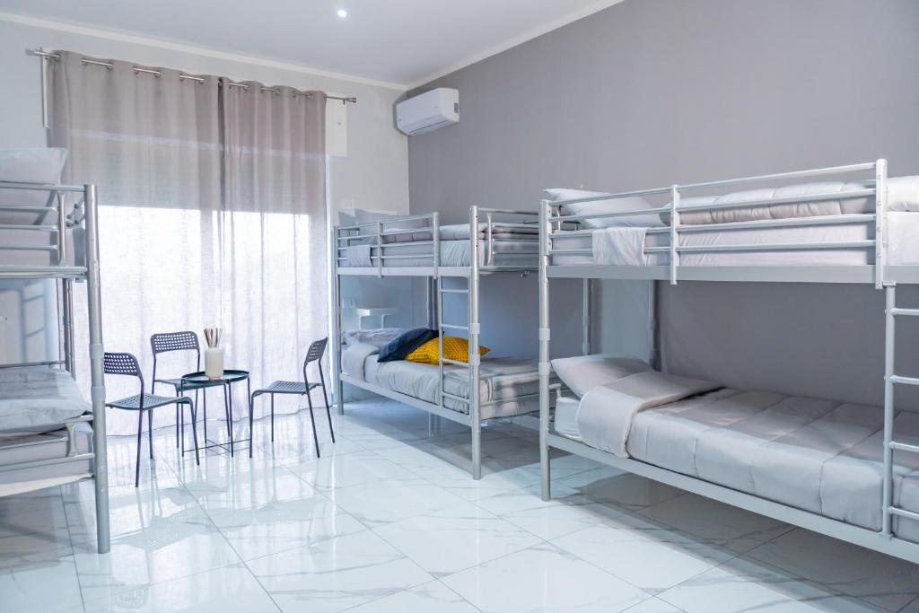 Postel nebo postele na pokoji v ubytování Hostel Partenope