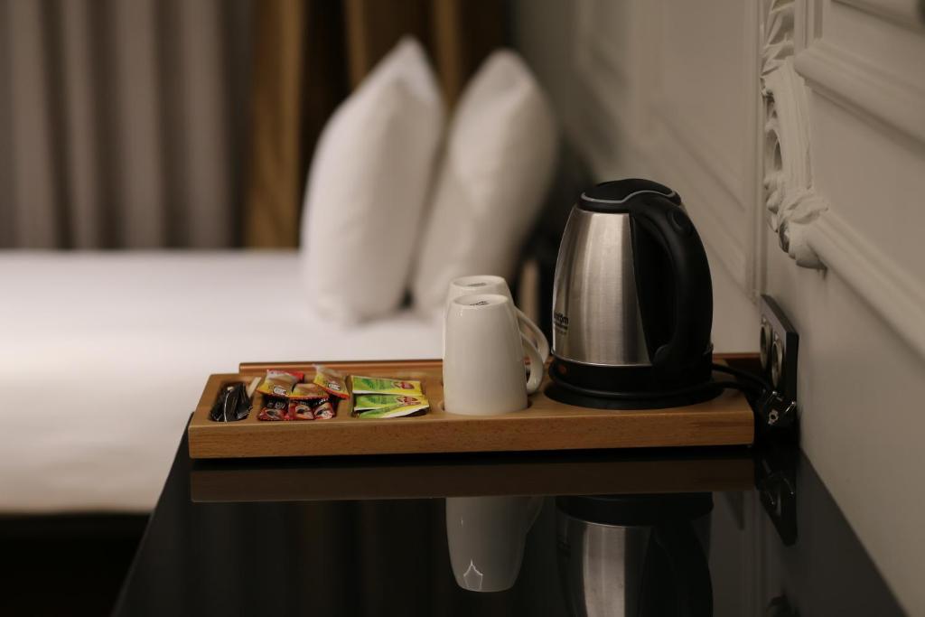 Postel nebo postele na pokoji v ubytování Lala Grand Hotel