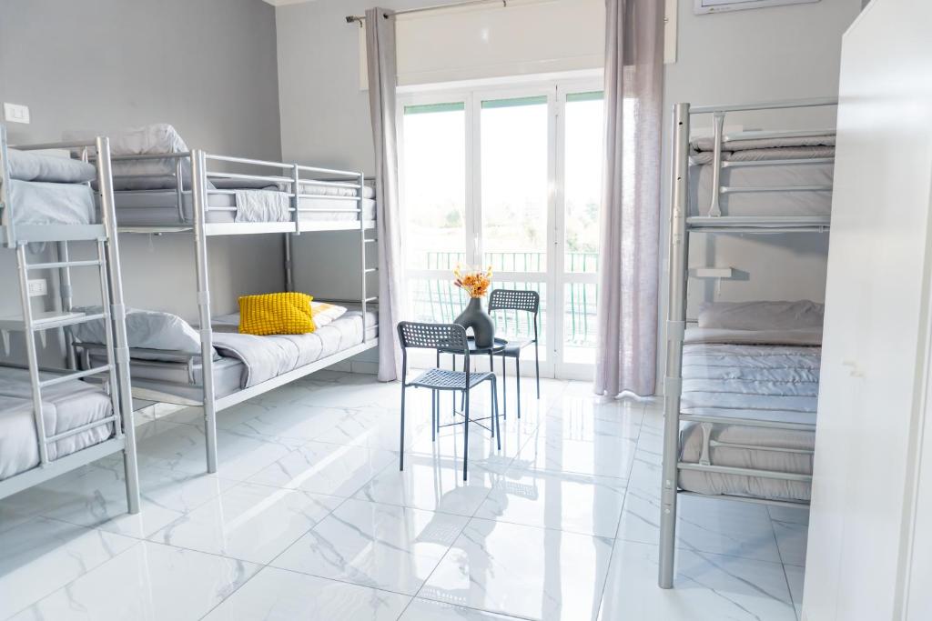 Postel nebo postele na pokoji v ubytování Hostel Partenope