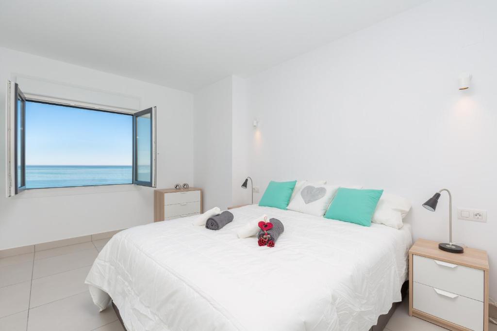 A bed or beds in a room at Fidalsa Paradise Sea Punta Prima
