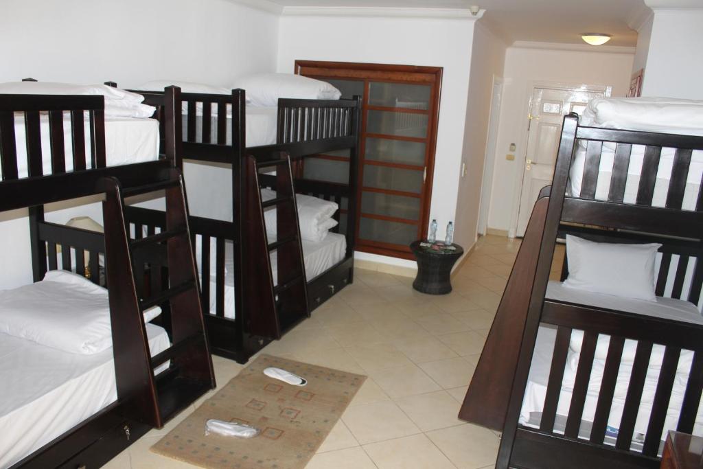 Postel nebo postele na pokoji v ubytování Herrmes Hostel