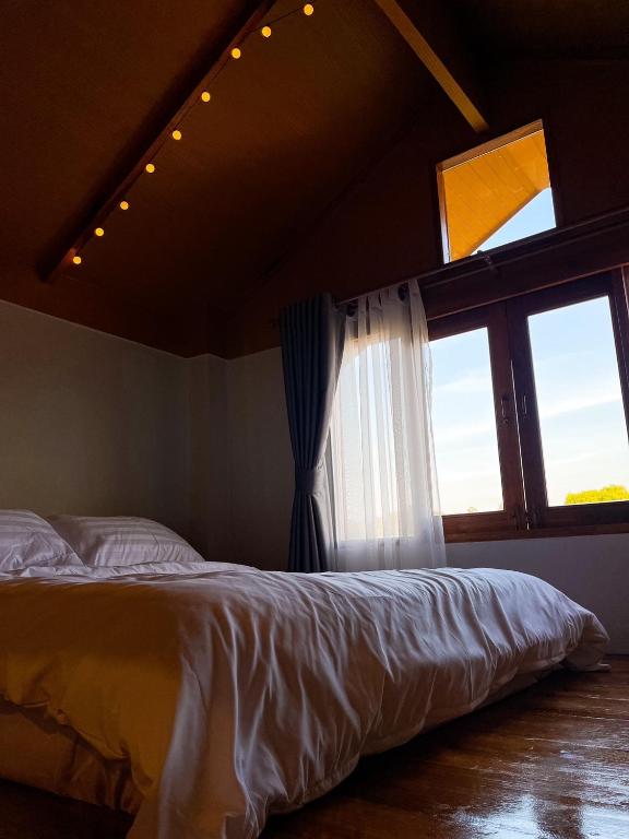 Postel nebo postele na pokoji v ubytování Sithaya Garden House @14