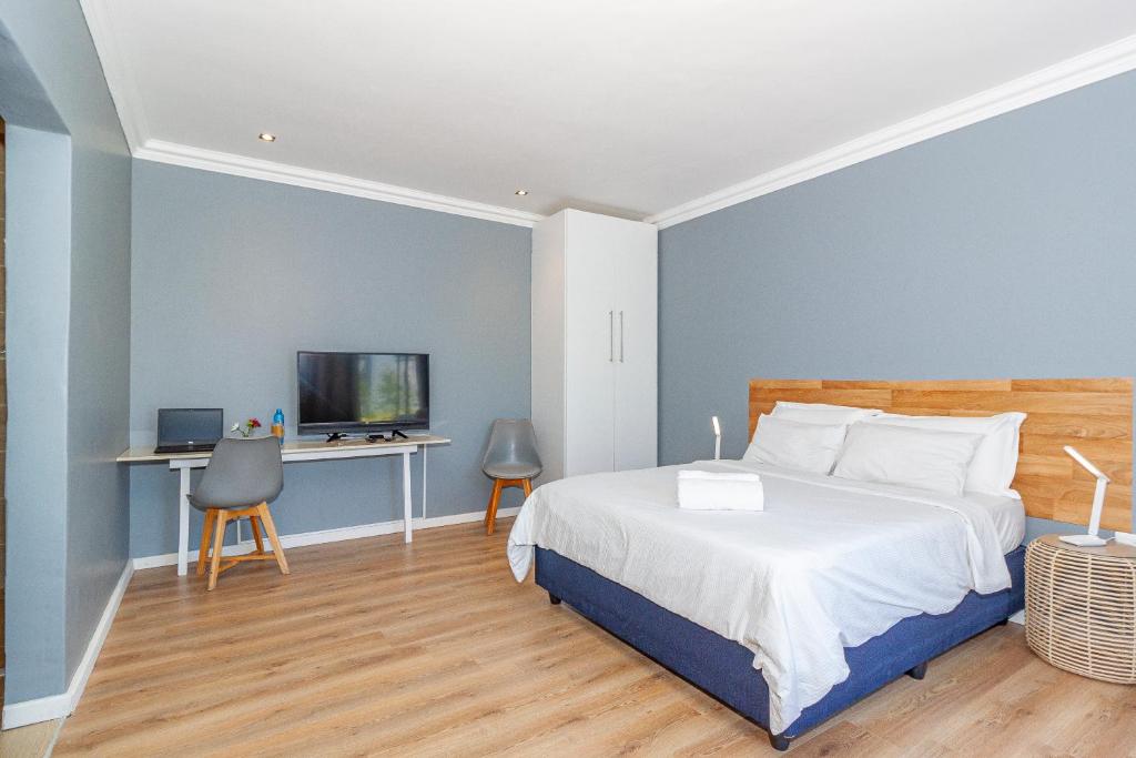 Postel nebo postele na pokoji v ubytování Bloubergstrandlodge