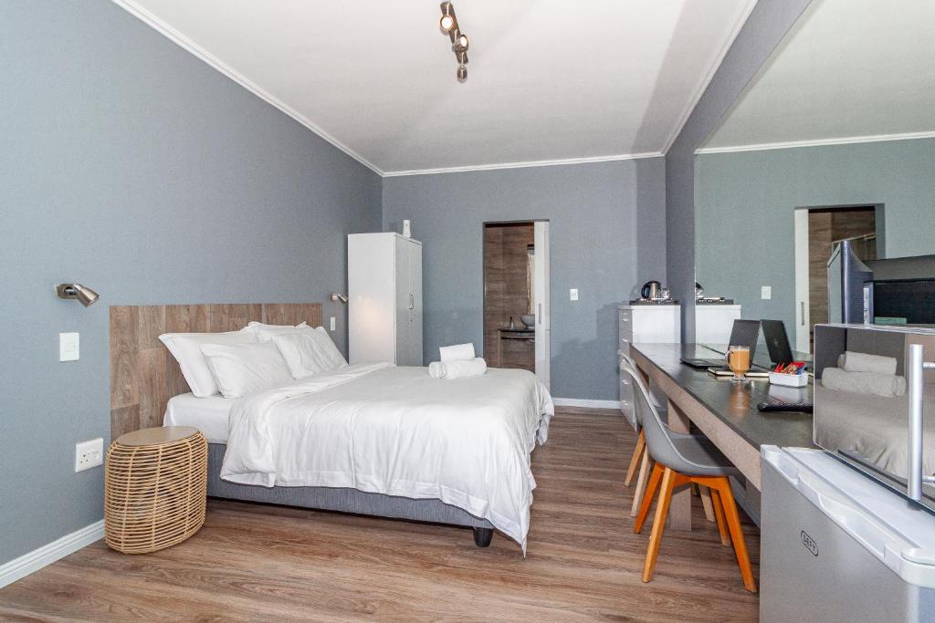 Postel nebo postele na pokoji v ubytování Bloubergstrandlodge