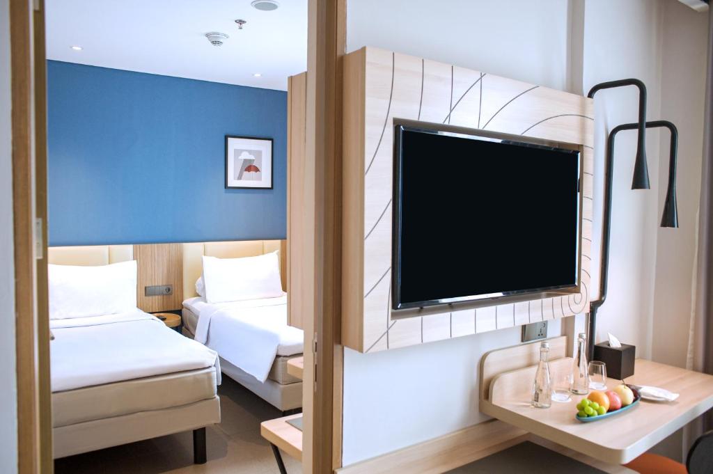 Postelja oz. postelje v sobi nastanitve ibis Styles Bogor Pajajaran