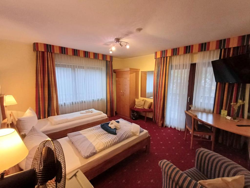 Postel nebo postele na pokoji v ubytování Günstige Zimmer im Spessart