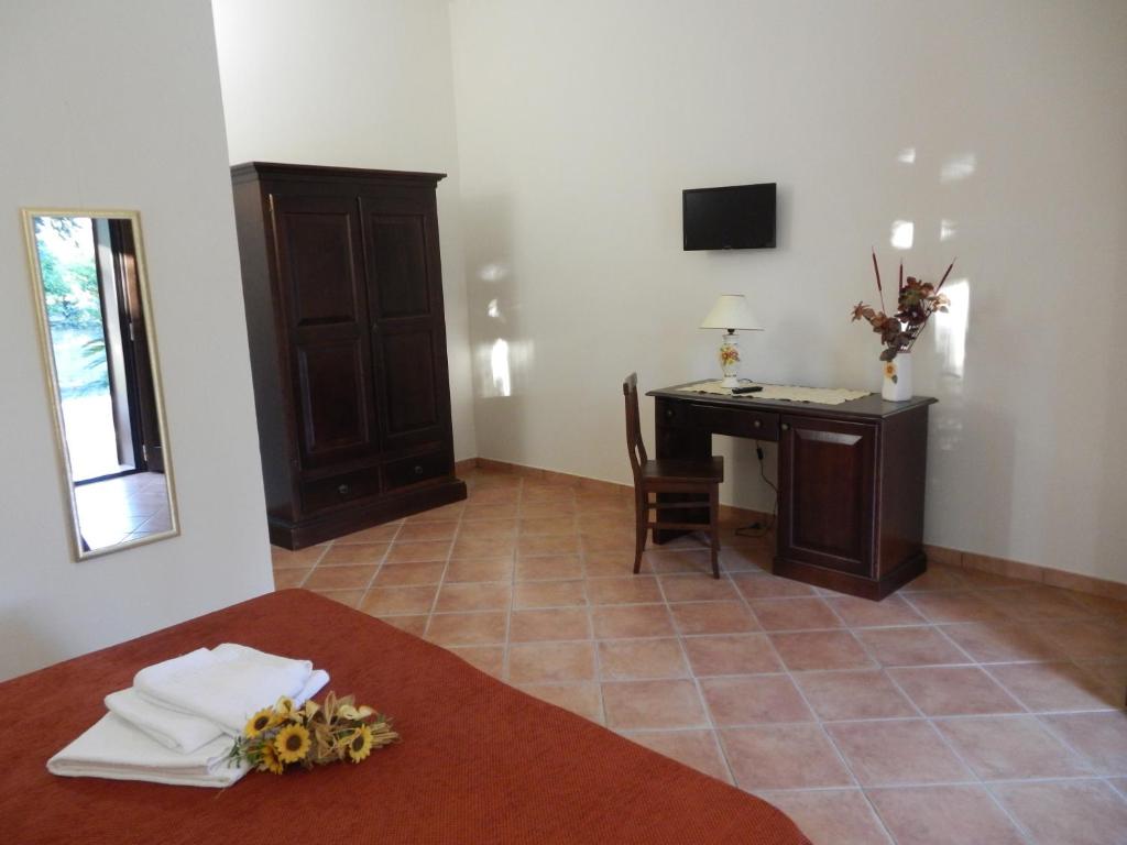 A bed or beds in a room at Agriturismo Monte degli Angeli