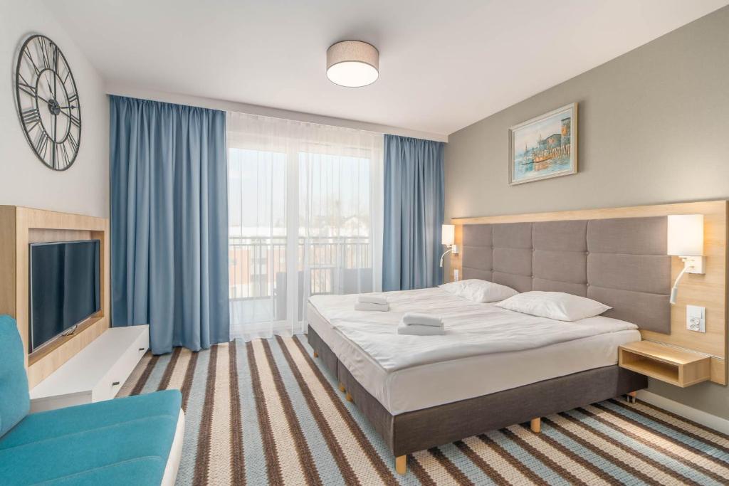 Posteľ alebo postele v izbe v ubytovaní Perfect Holiday Apartments Bel Mare by Noclegi Renters