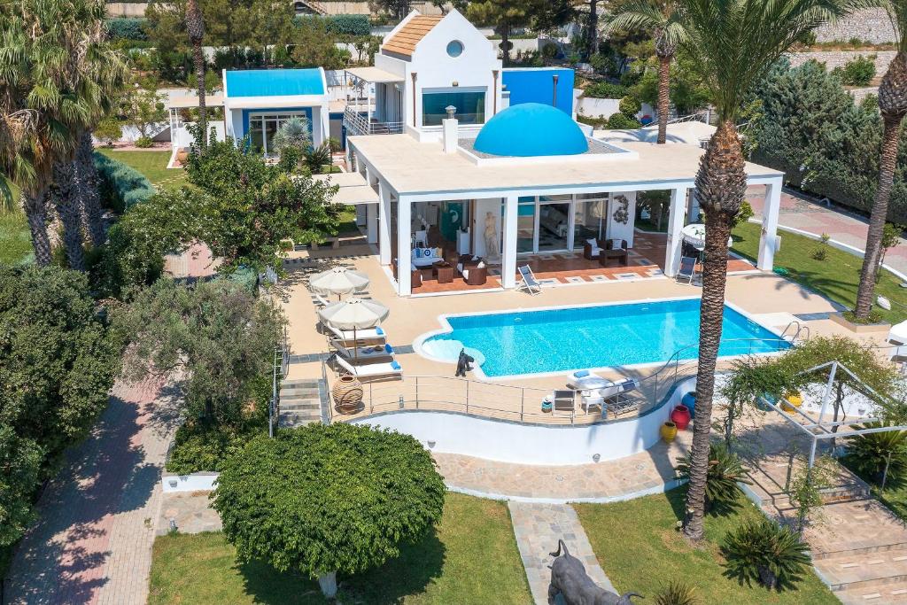 an aerial view of a house with a swimming pool at Grande Dame Villa of Rhodes in Rhodes Town