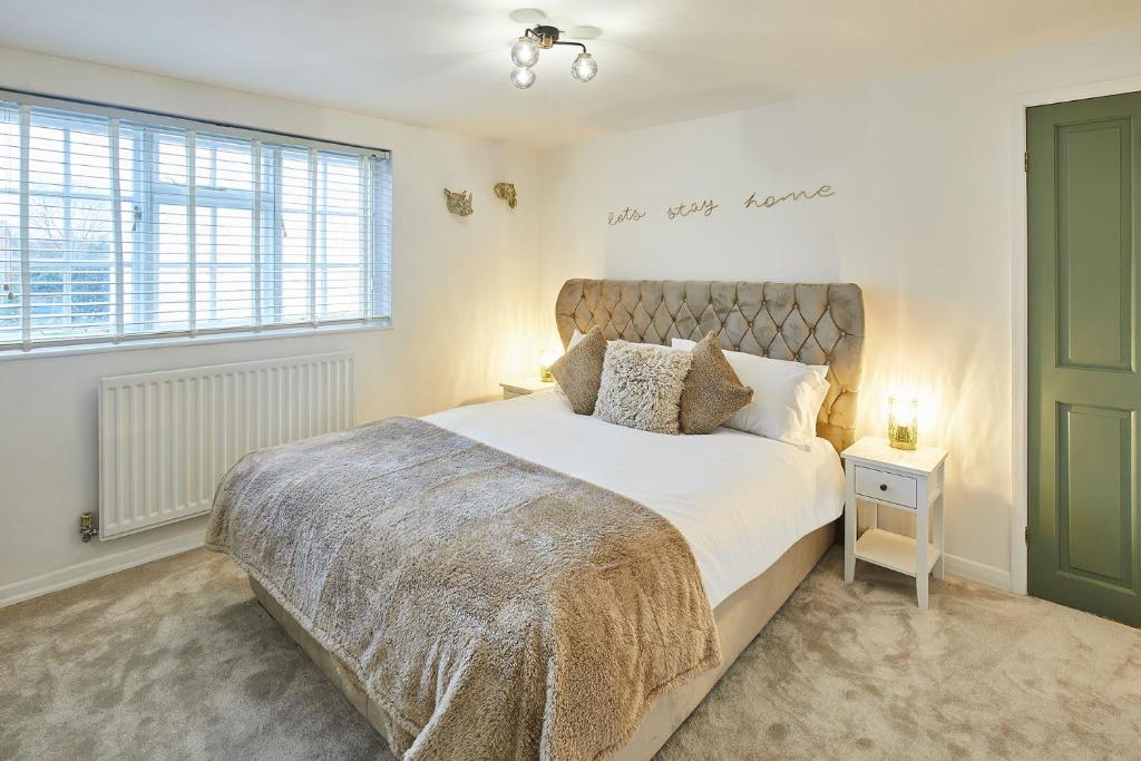 a bedroom with a large bed and a window at Host & Stay - Bentley Wynd in Yarm