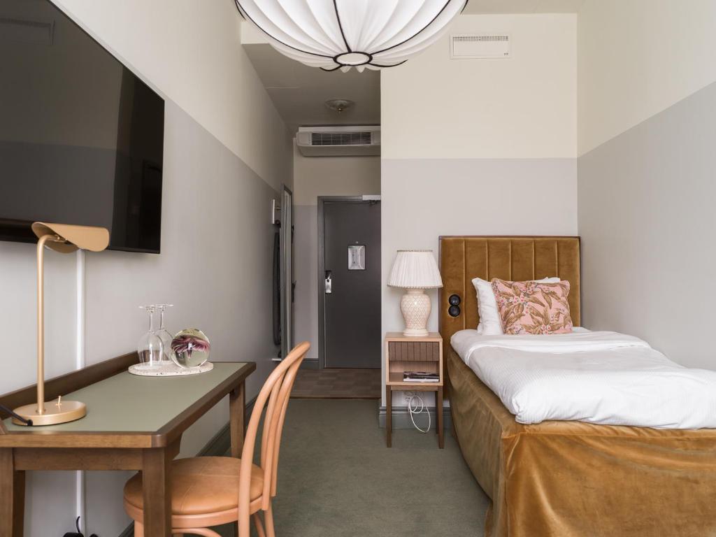 Postel nebo postele na pokoji v ubytování Elite Hotel Mårtenson