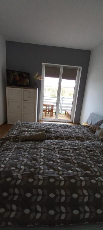 Postel nebo postele na pokoji v ubytování Onix-Vital Apartman Orfű