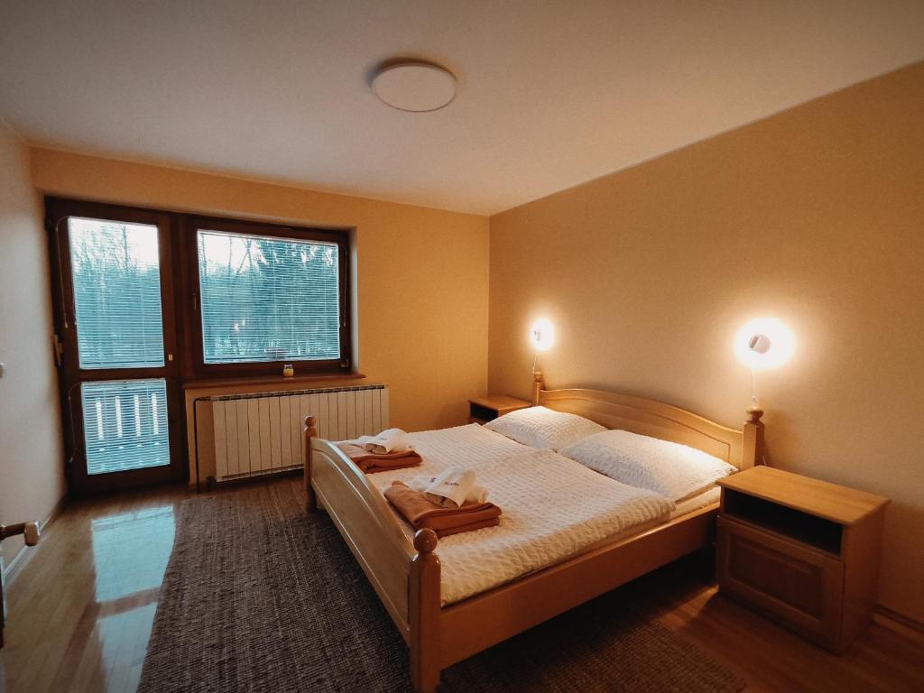 Postel nebo postele na pokoji v ubytování Rooms and Apartments Panker