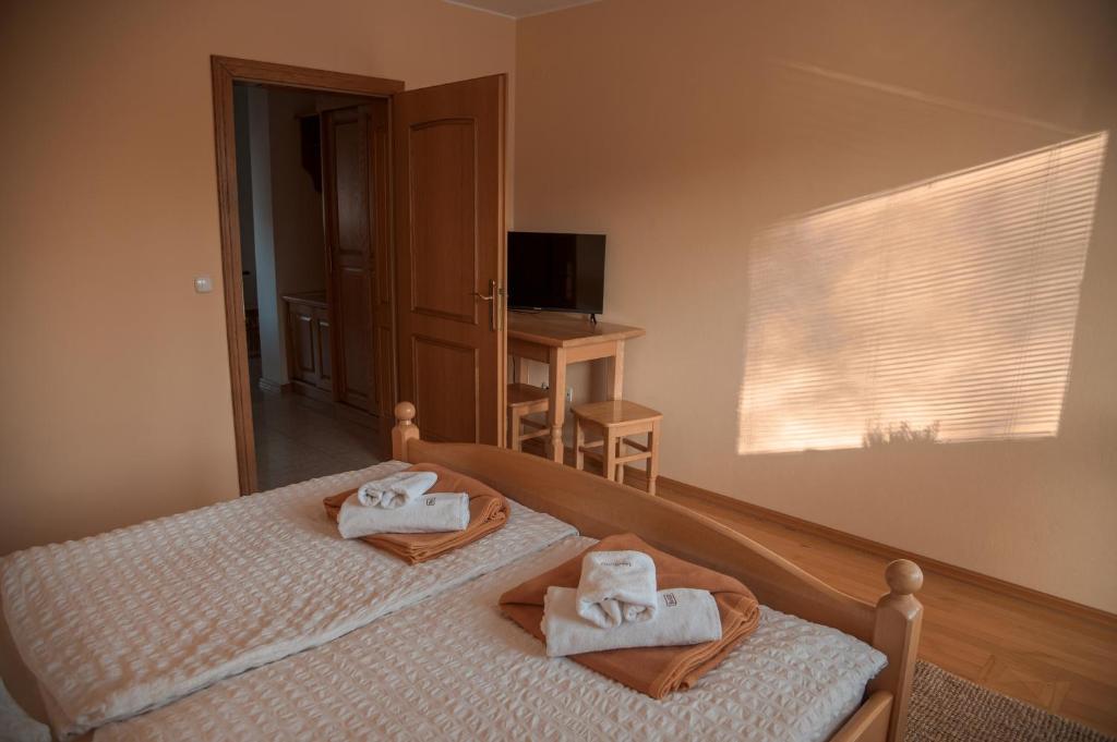 Postel nebo postele na pokoji v ubytování Rooms and Apartments Panker