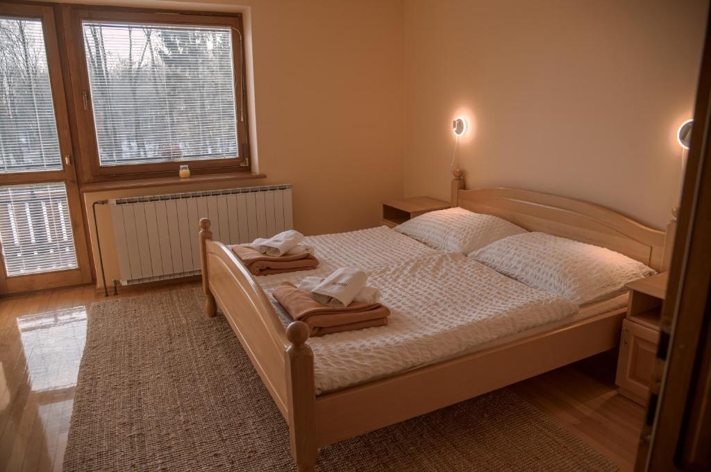 Postel nebo postele na pokoji v ubytování Rooms and Apartments Panker
