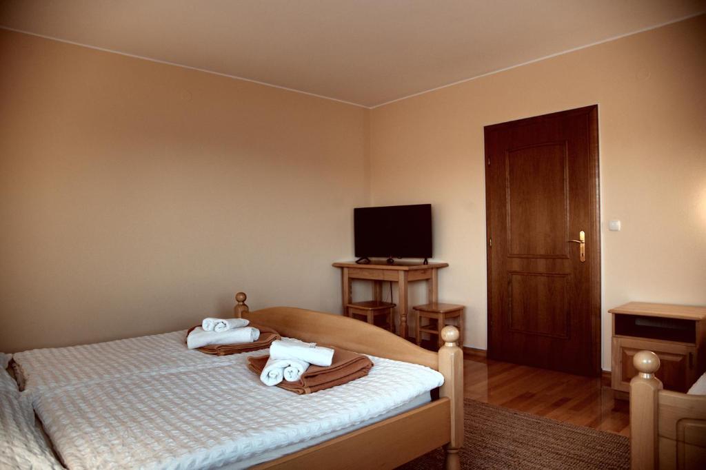 Postel nebo postele na pokoji v ubytování Rooms and Apartments Panker