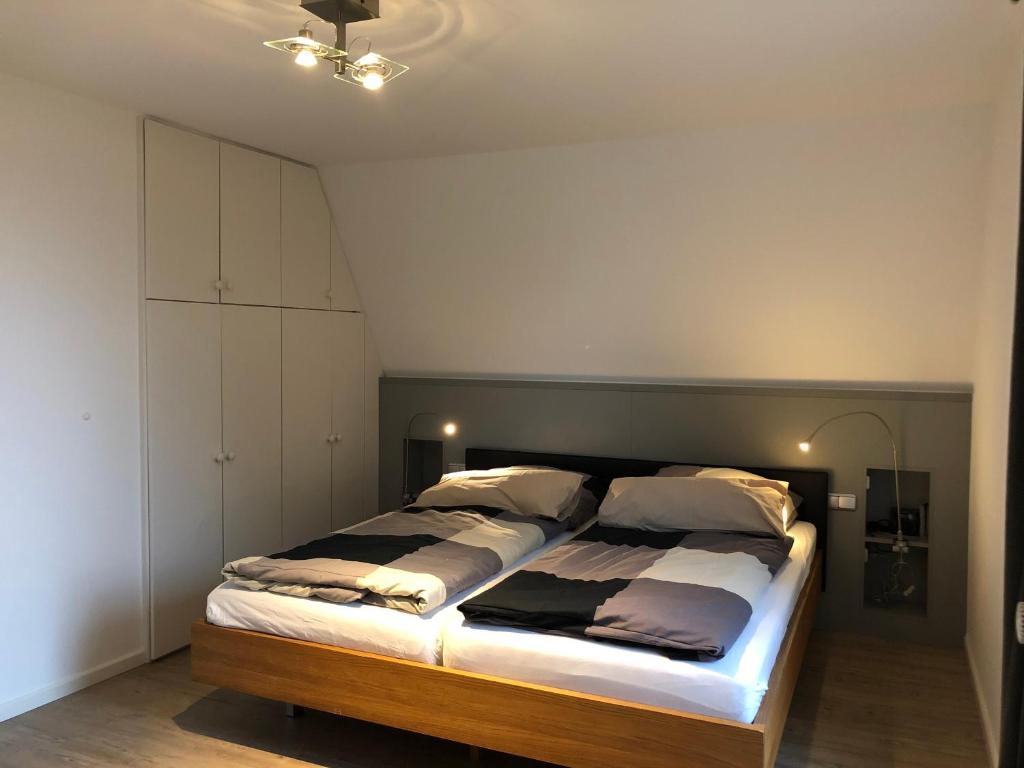 a bedroom with a large bed in a room at Schlei 48 in Borgwedel