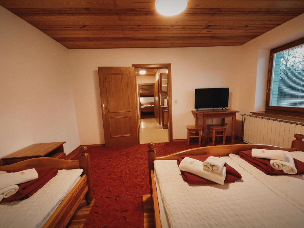 Postel nebo postele na pokoji v ubytování Rooms and Apartments Panker