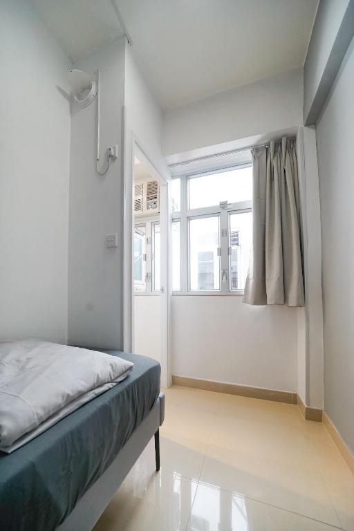 Postel nebo postele na pokoji v ubytování Student Accommodation - 294 Hennessy Road