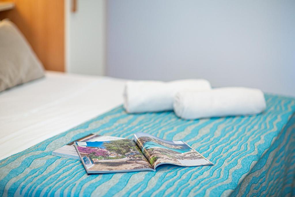 Postel nebo postele na pokoji v ubytování Hotel Danieli